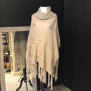 Taupe cowl neck warm poncho sweater with tassels